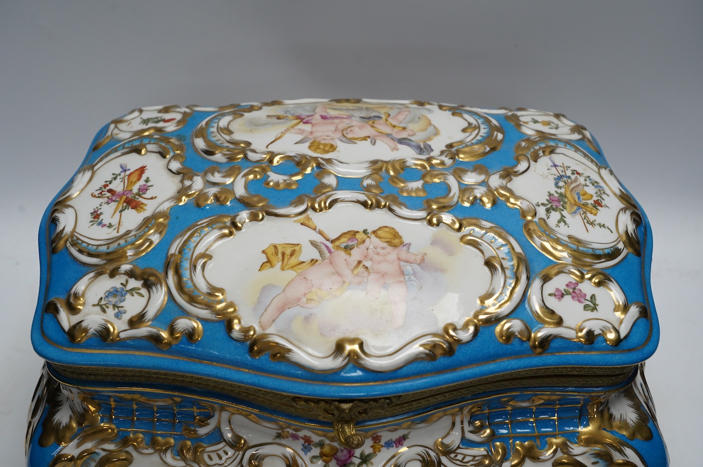 A large Sevres style porcelain casket, 33cm wide. Condition - good